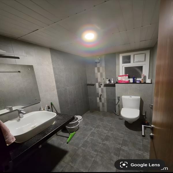 Modern bathroom, clean bathroom space, stylish bathroom interior, rental room bathroom, shared accommodation bathroom, bathroom for working professionals, bathroom for students, comfortable rental living, hygienic bathroom, well-maintained bathroom, spacious bathroom, modern wash basin, ceramic wash basin, bathroom vanity, granite countertop, western toilet, clean toilet area, tiled bathroom, grey tile bathroom, contemporary bathroom design, residential bathroom, apartment bathroom, rental accommodation, student accommodation, professional accommodation, affordable room rental, comfortable room facilities, private bathroom, shared bathroom facility, well-equipped bathroom, bathroom amenities, functional bathroom, neat washroom, spacious washroom, modern washroom, bathroom with storage, bathroom mirror, bathroom sink, bathroom fixtures, quality bathroom fittings, clean living space, convenient accommodation, furnished rental room, comfortable stay, home-like accommodation, bachelor accommodation, student-friendly accommodation, working professional accommodation, premium room facilities, ready-to-move accommodation, modern rental property.